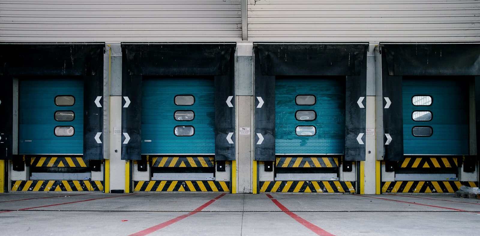 Row of loading dock doors at a light industrial building